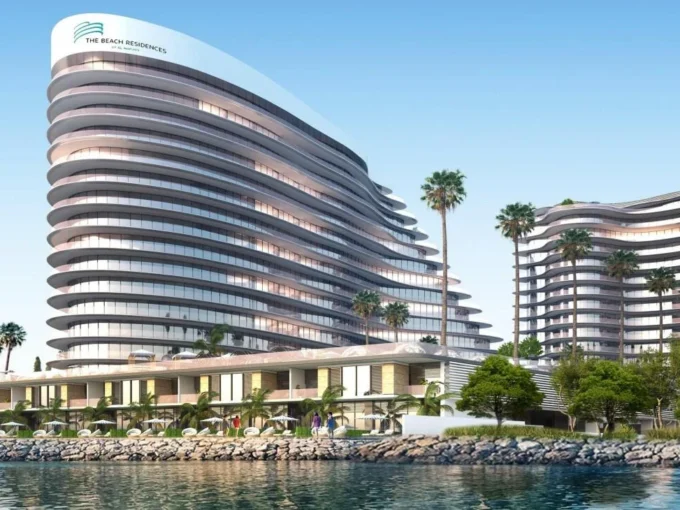 A sleek, modern, multi-story building, "The Beach Residence," curves along a waterfront. Palm trees dot the landscape.